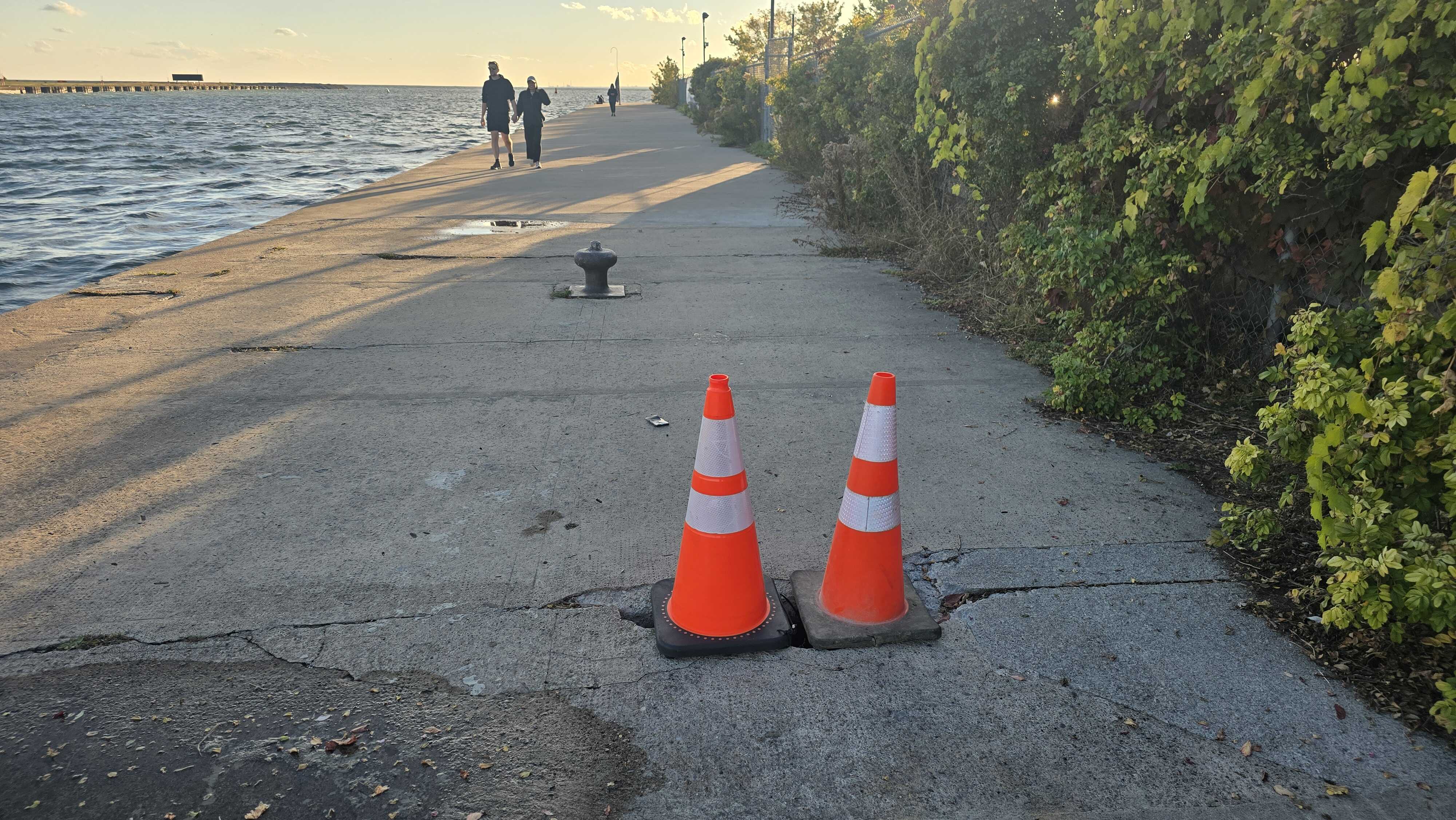 Doubling down on Safetymaking by adding extra orange cone pylons to help protect people from falling in the dangerous holes.